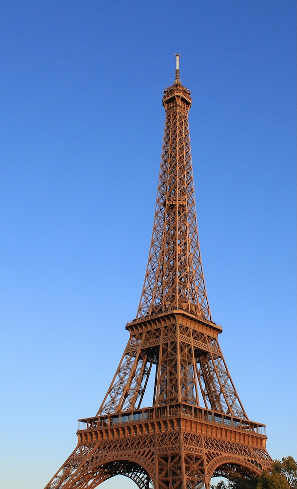 The Eiffel Tower beneath a blue sky